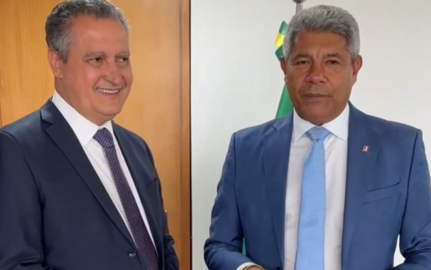 O governador Jerônimo Rodrigues e o ministro Rui Costa aparecem lado a lado, usando ternos, durante anúncio de investimentos do Novo PAC Seleções.